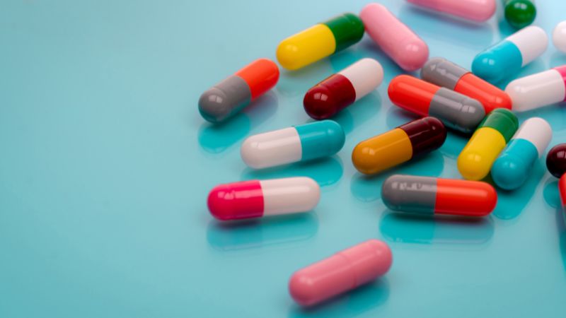 Various colourful pills scattered